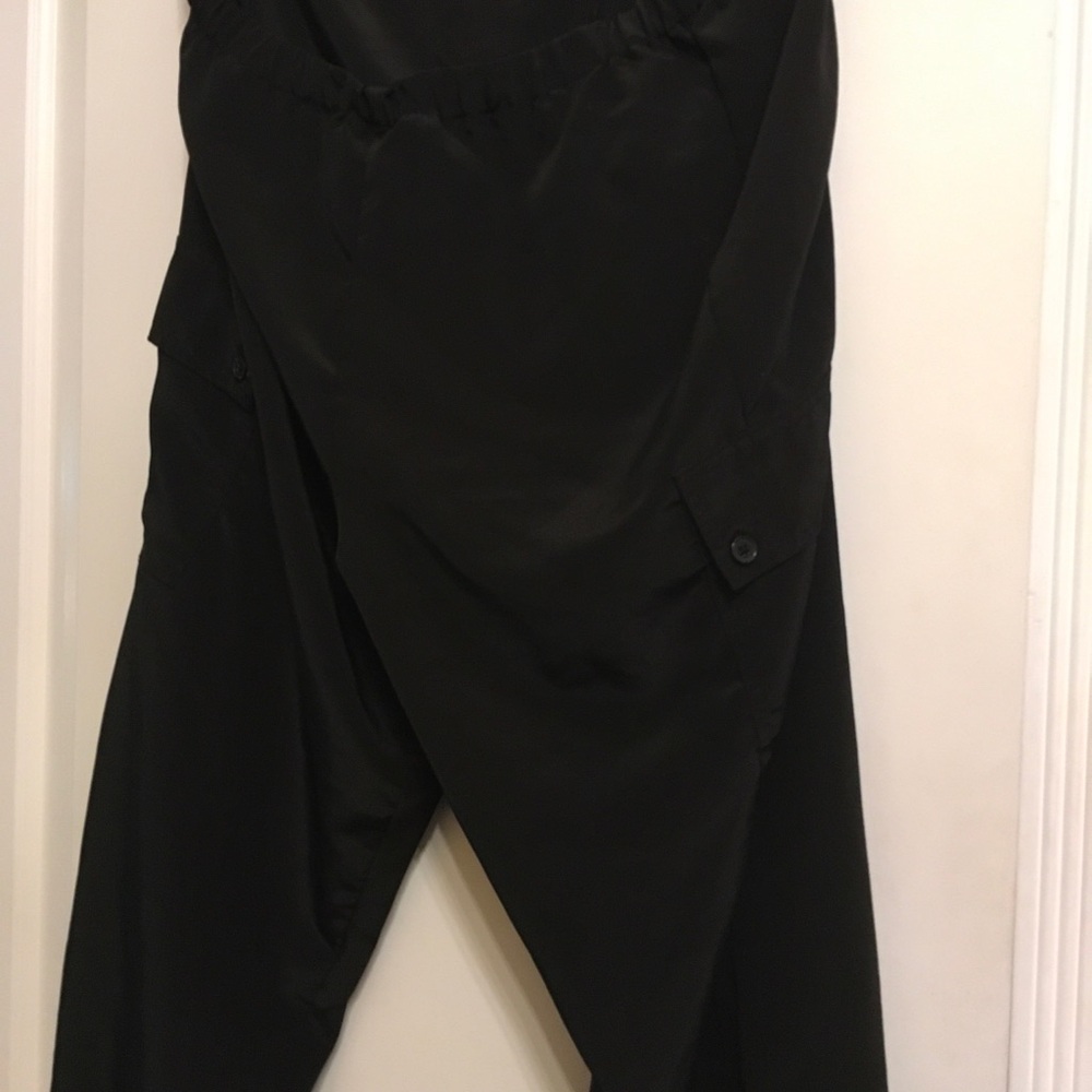 Black womens Relaxed Cargo Pants, silky, dressy, elastic bottoms. Never worn!